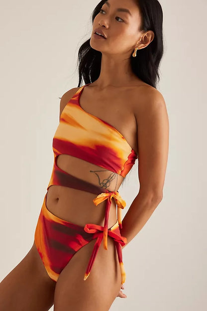 Circular Thrift one-shoulder swimsuit in sunset tie-dye with side cut-outs and adjustable tie-side detailing.