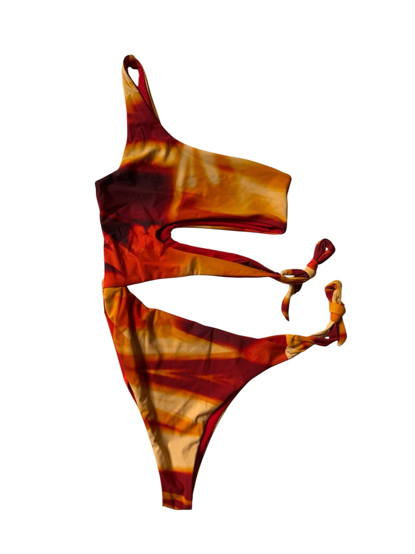 Circular Thrift one-shoulder swimsuit in a vibrant red, orange, and yellow sunset tie-dye print with side cut-outs.